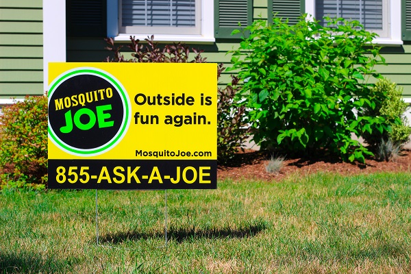 Yellow and Black Mosquito Joe Yard sign in front of Cincinnati home
